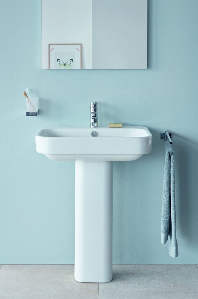 Classic pedestal wash basin installed in a modern bathroom with clean lines and elegant ceramic finish.