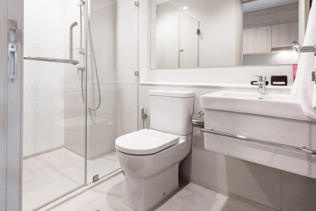 Modern Western commode installed in a contemporary bathroom with elegant interior design